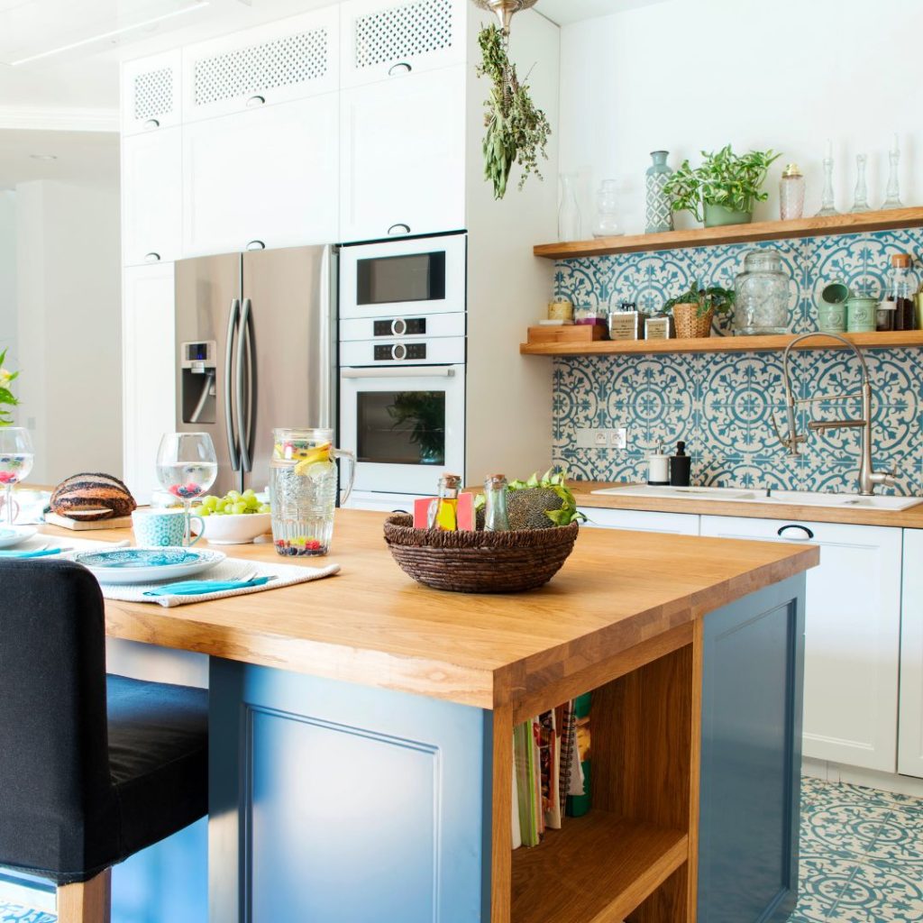 kitchen with natural wood, open shelving and colorful wallpaper - Top 10 Home Renovation Trends for 2024